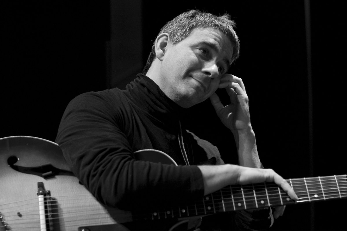 Dan Rochlis onstage in an archive performance photo